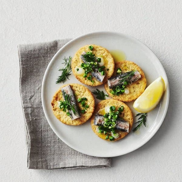 AIP Rustic Sardine Bite on Cassava Crackers with Lemon, Olive Oil and Herbs