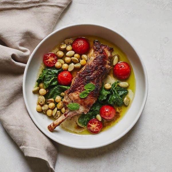 Tunisian Harissa Lamb Skillet with Pumpkin Seed, Cherry Tomato and Mint