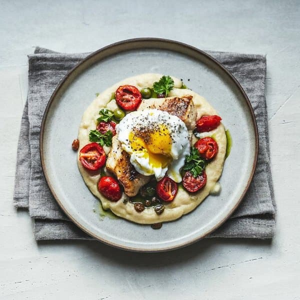 Calabrian Cod over Soft Polenta with Blistered Tomato and Soft Egg