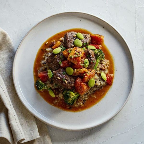 Pugliese Beef Ragù over Quinoa with Broccoli Rabe and Pumpkin-Seed Drizzle