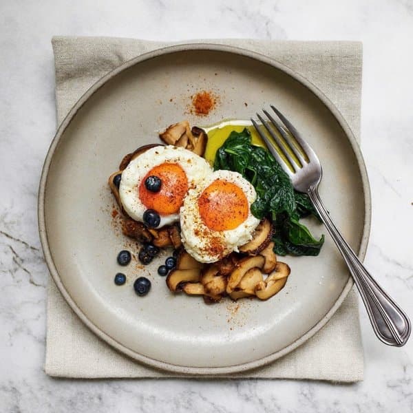 Turmeric-Ginger Eggs with Shiitake, Wilted Spinach, and Blueberry Side