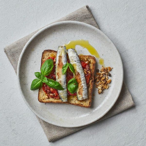 Bolognese Sardine Breakfast Toast with Slow Tomato, Basil and Brazil Nut Crumble