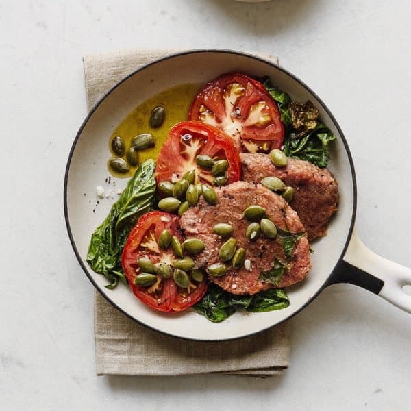 Mallorcan Iron Breakfast Skillet with Pumpkin Seed, Slow Tomato and Wilted Spinach
