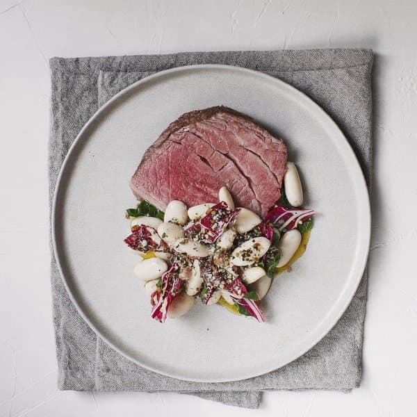 Sardinian Seared Beef with White Beans, Wilted Chard and Grated Bottarga