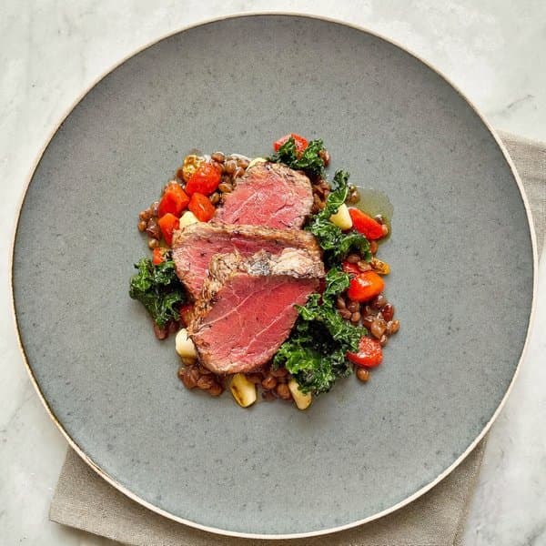 Tuscan Braised Lentils with Seared Grass-Fed Beef and Wilted Kale