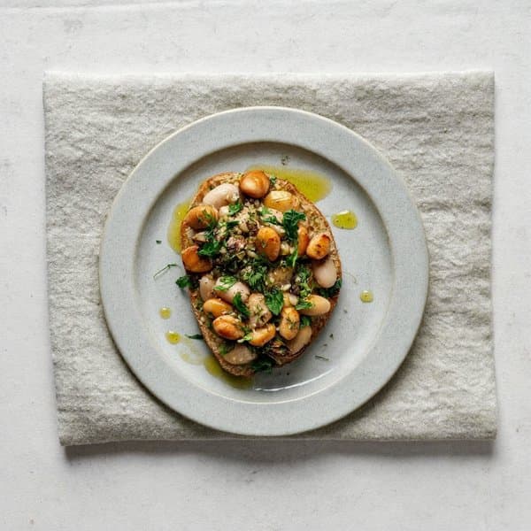 Asturian Warm White Bean Bite with Brazil Nut and Sunflower Picada
