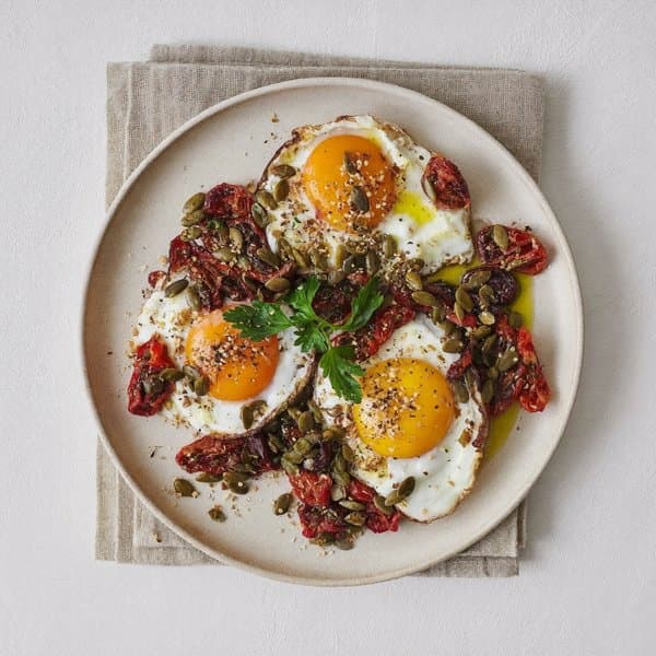Spanish Pumpkin-Seed Crusted Eggs with Sun-Dried Tomato & Parsley