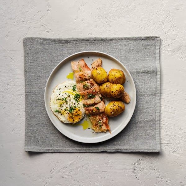 Galician Cod Breakfast Plate with Soft Egg, Pimentón Potato and Parsley Oil