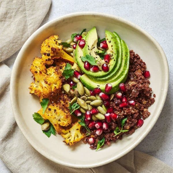 Spiced Lamb and Pumpkin-Seed Bowl with Turmeric-Roasted Cauliflower, Avocado and Pomegranate