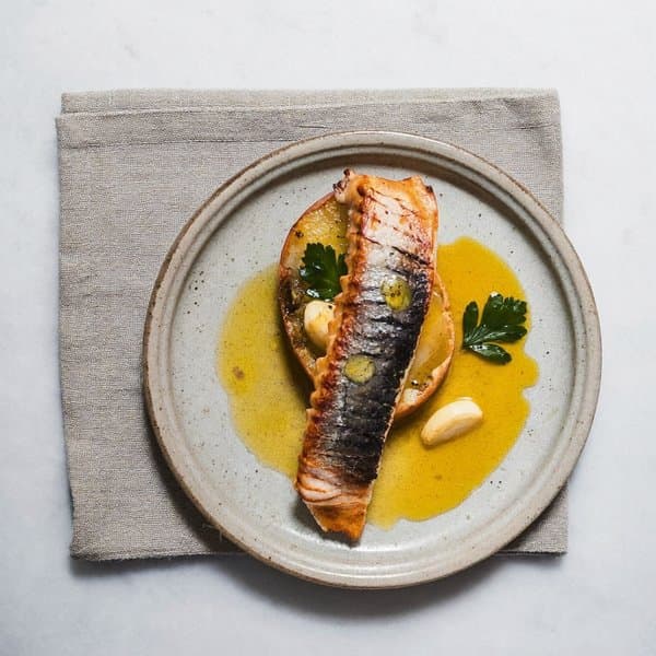 Galician Flaked Cod and Pimentón Potato Bite with Parsley Oil