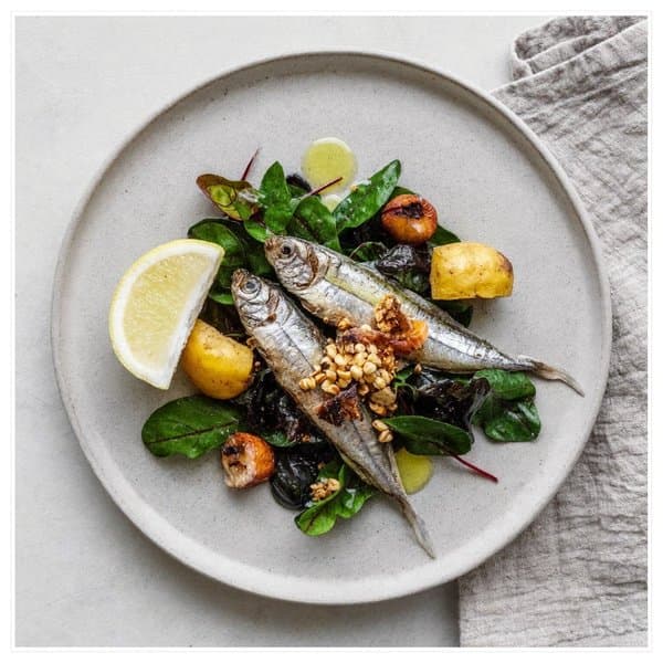 Cretan Sardines over Wild Greens with Brazil Nut and Lemon