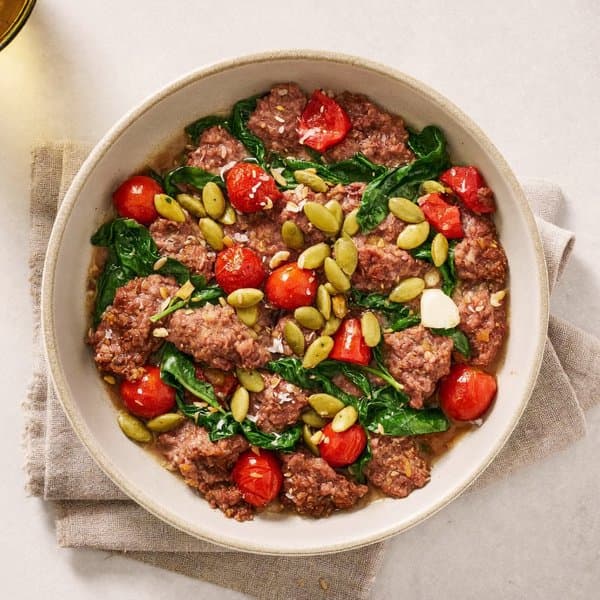 Mallorcan Beef Sofrito Skillet with Pumpkin Seeds, Tomato and Wilted Spinach