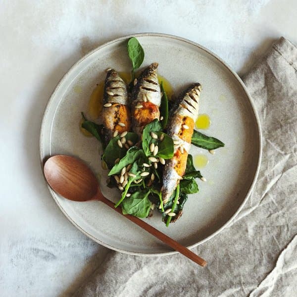Turmeric-Ginger Sardines over Wilted Greens with Olive-Lemon Drizzle